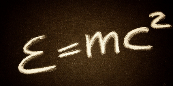 E=mc squared written on a chalk board